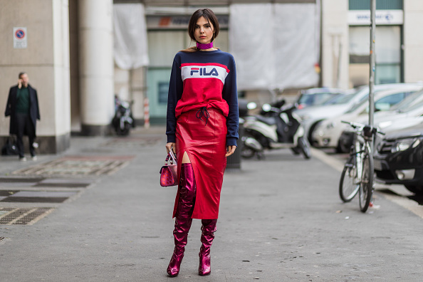 MILAN, ITALY - FEBRUARY 26: Doina Ciobanu wearing a Fila sweater, red leather skirt, Louboutin overknees outside Salvatore Ferragamo during Milan Fashion Week Fall/Winter 2017/18 on February 26, 2017 in Milan, Italy. (Photo by Christian Vierig/Getty Images)